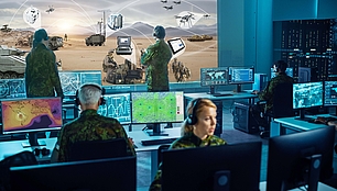 Military control room with spectrum displays for defense communications and operational planning.