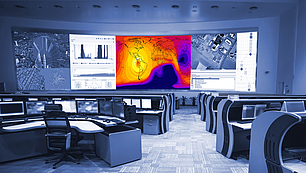 Control room with coverage and interference displays for technical spectrum engineering and analysis.