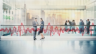 Business setting with radio wave graphic for spectrum policy, licensing and frequency management.